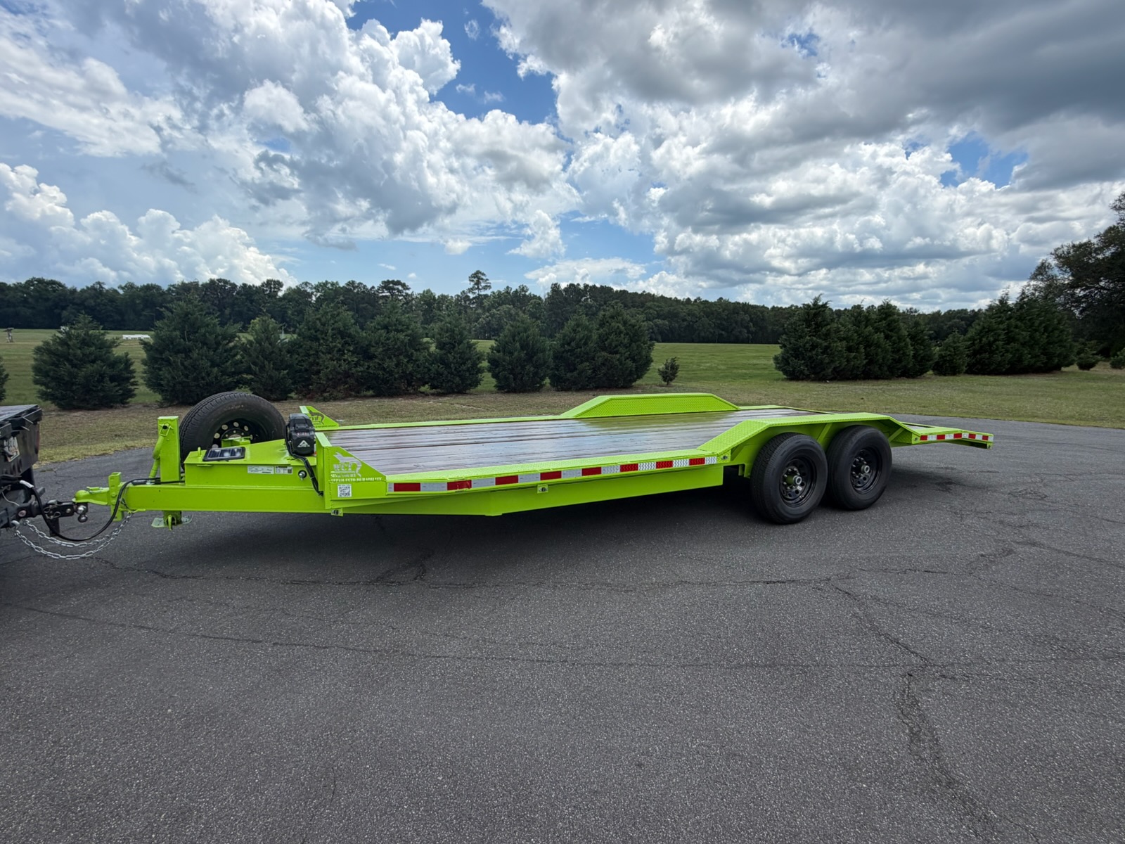 Lime green 20ft tilt deck trailer available for rent at HAPPY HITCH Trailer Rentals in Ellabell, Georgia